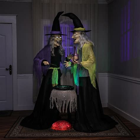 Animatronic witch with cauldronn